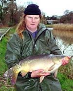 a 20lb Mirror Carp being introduced into Mopley Pond.